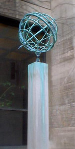 Two views of the old copper open wire globe that was outside Rosenwald Hall, now ouside Hinds Geophysical Laboratory