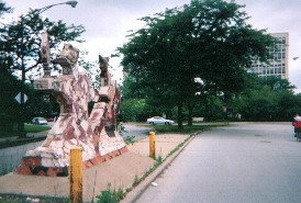 Sculture put in the median of 5th near Hyde Park Shopping Center and University Apts. (background) c. 1970. Ossewaarde
