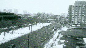Looking east down 55th and the berm c. 2000, before the new parking garage/Seven Ten rest. & bowling ? Prominent on the south is Pierce Tower (c. 1958), on the north near is Lutheran School of Theology (1966). Notable is the openness an broad width.