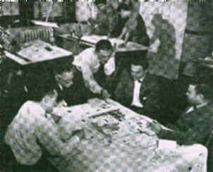Planning urban renewal in the mid 1950s. Jack Meltzer center,  Julian Levi of U of C and SECC seated with glasses.