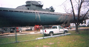 Views of the sub as it is brought out and rouds the corners of the Museum