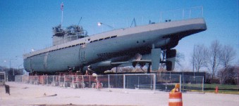 Views of the sub as it is brought out and rouds the corners of the Museum