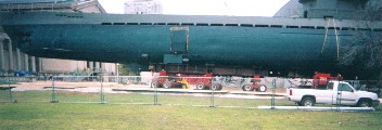 Views of the sub as it is brought out and rouds the corners of the Museum
