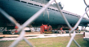 Views of the sub as it is brought out and rouds the corners of the Museum
