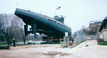 Views of the sub as it is brought out and rouds the corners of the Museum