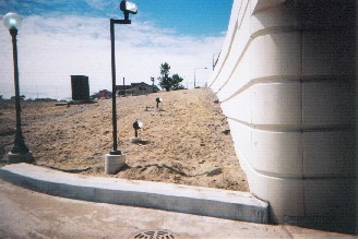 Sleek neomoderne rounded corner with streamlines and start of southeast ramp