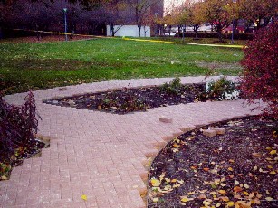 Half--circle English garden walks west of the north fountain plaza