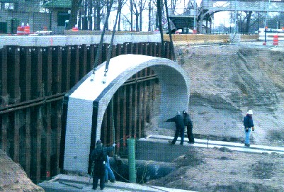 Installing 63rd underpass barrel arch section. CDOT/Edwards & Kelcey