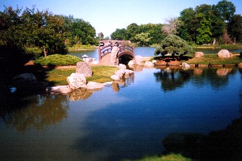 Pond and moon bridge approach Osaka Garden
